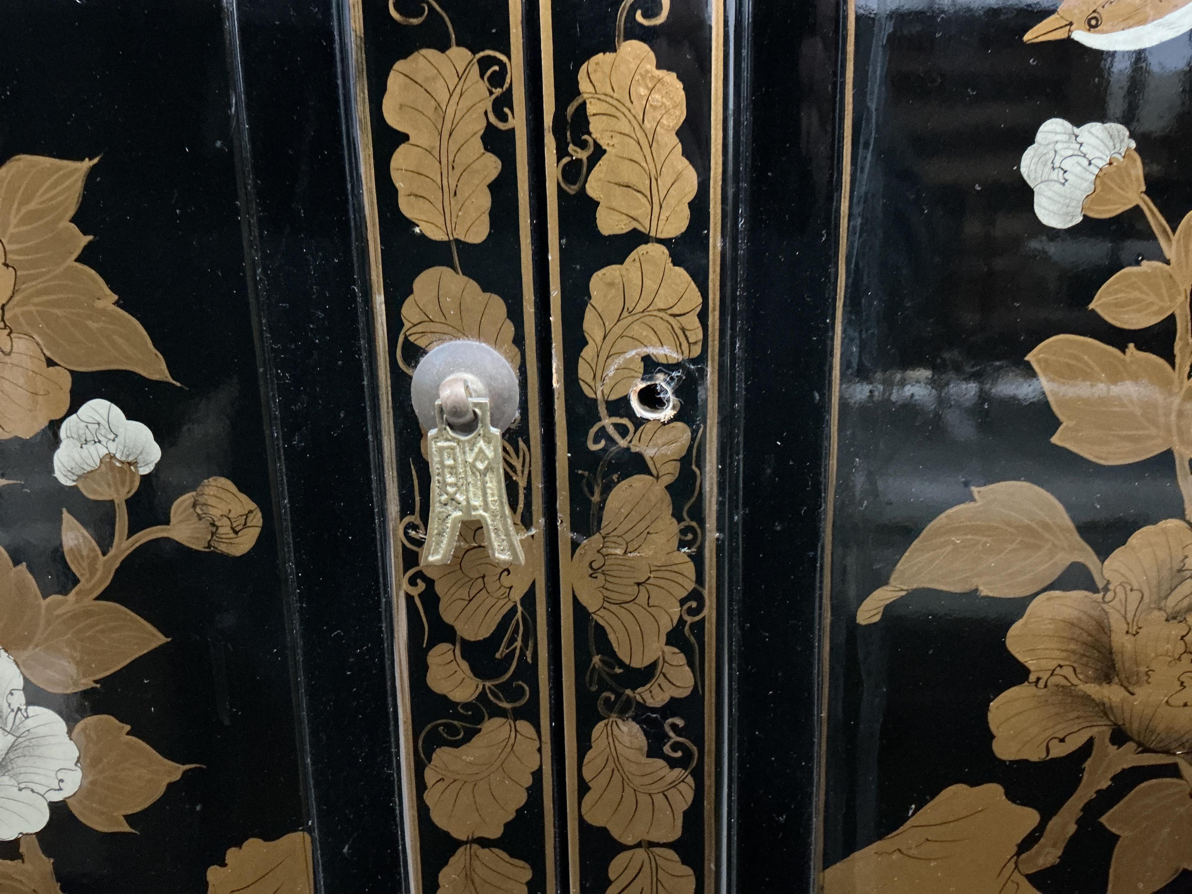A small Chinese lacquered side cabinet, width 61cm, depth 30cm, height 67cm